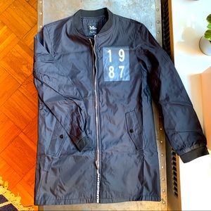 Black full-zip lightweight, nylon jacket